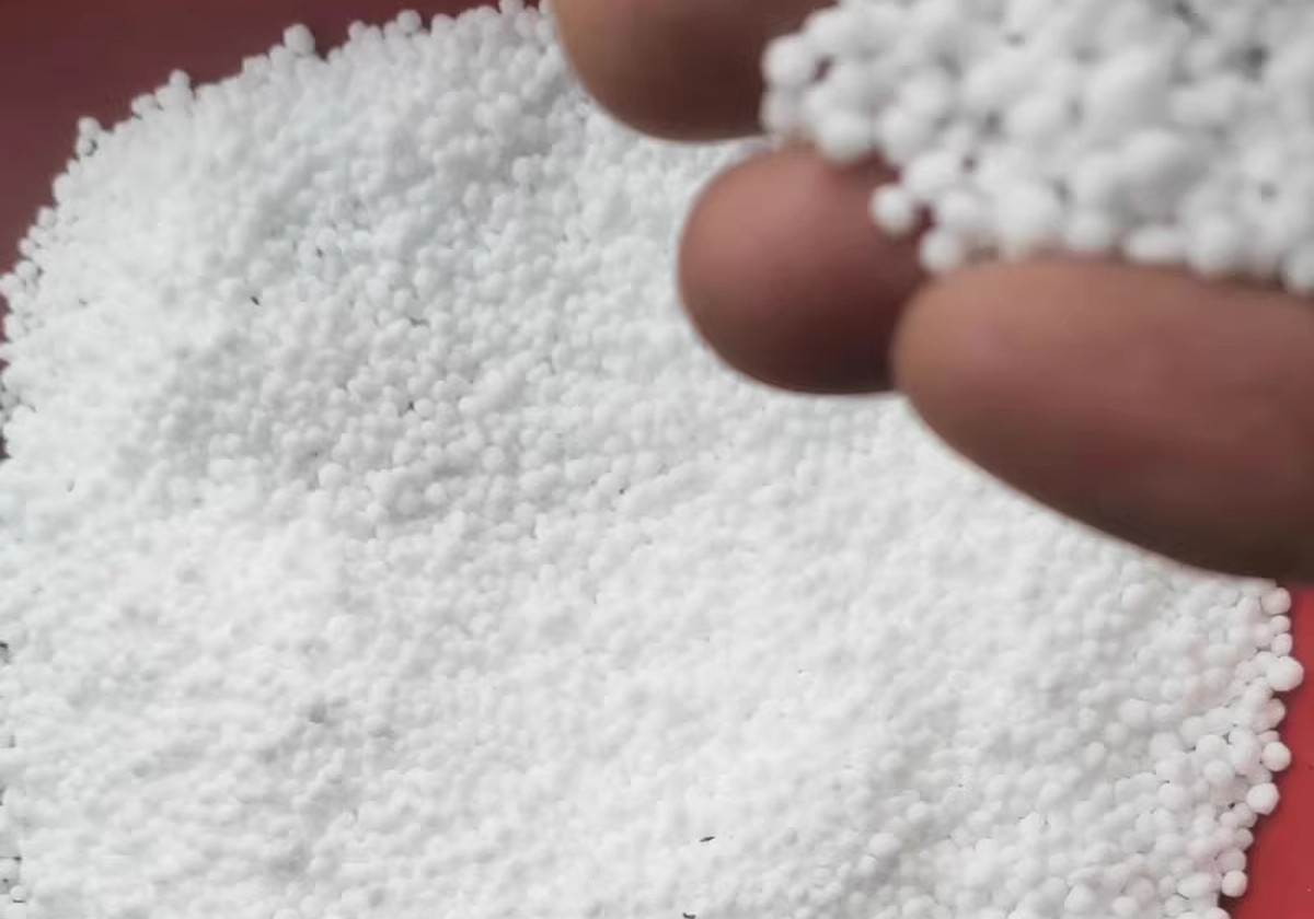 Urea granular fertilizer sample close-up
